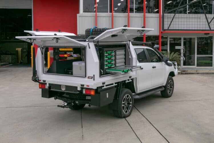 Caddy Storage utility vehicle with custom fitout for the Variety Bash, featuring drawers, shelving, and roof racks for outback support.
